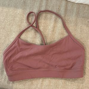 Lululemon sports bra in a mauve pink color